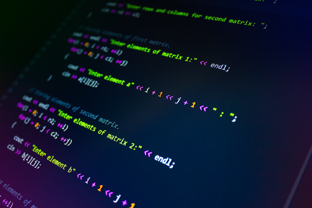The Art of Drawing Readers In: Your attractive post title goes here Close-up of colorful programming code displayed on a monitor screen.